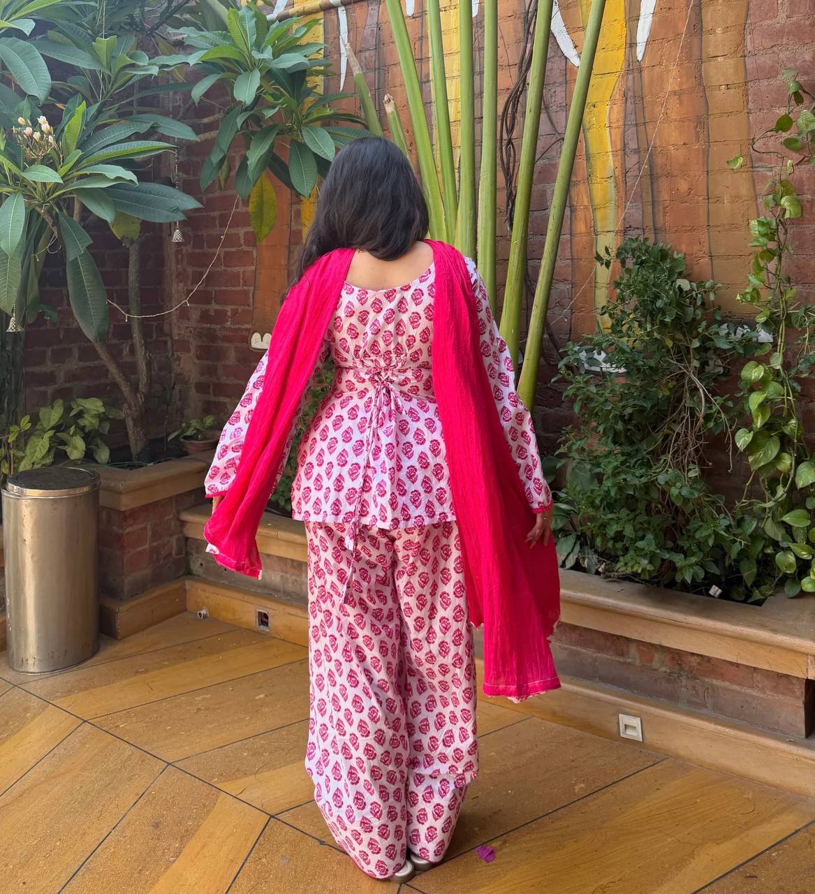Charming Pink Floral Block Print Peplum Kurti and Wide-Leg Palazzo Suit Set Featuring an Elegant Tie-Up Back and Solid Vibrant Dupatta